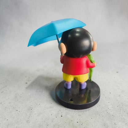 Shinchan Rainy Day Figurine with Umbrella & Frog – Cute Cartoon Collectible ( 9 CM)