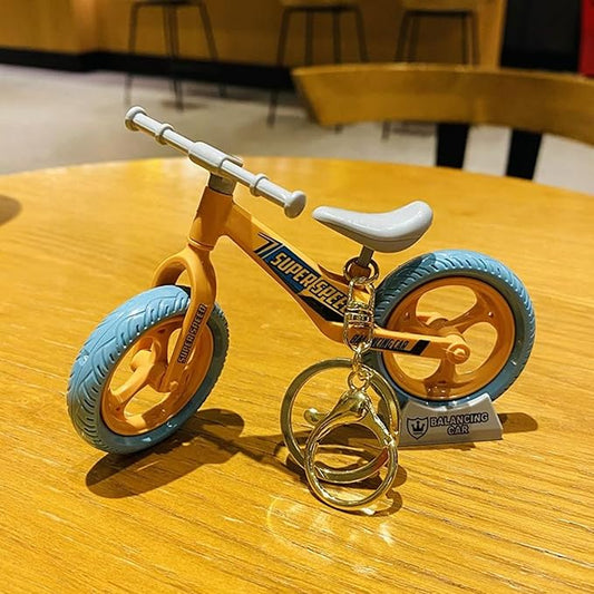 3D Design Base Stand Cycle Keychain with Movable Sliding Wheel.(Assorted Colours)